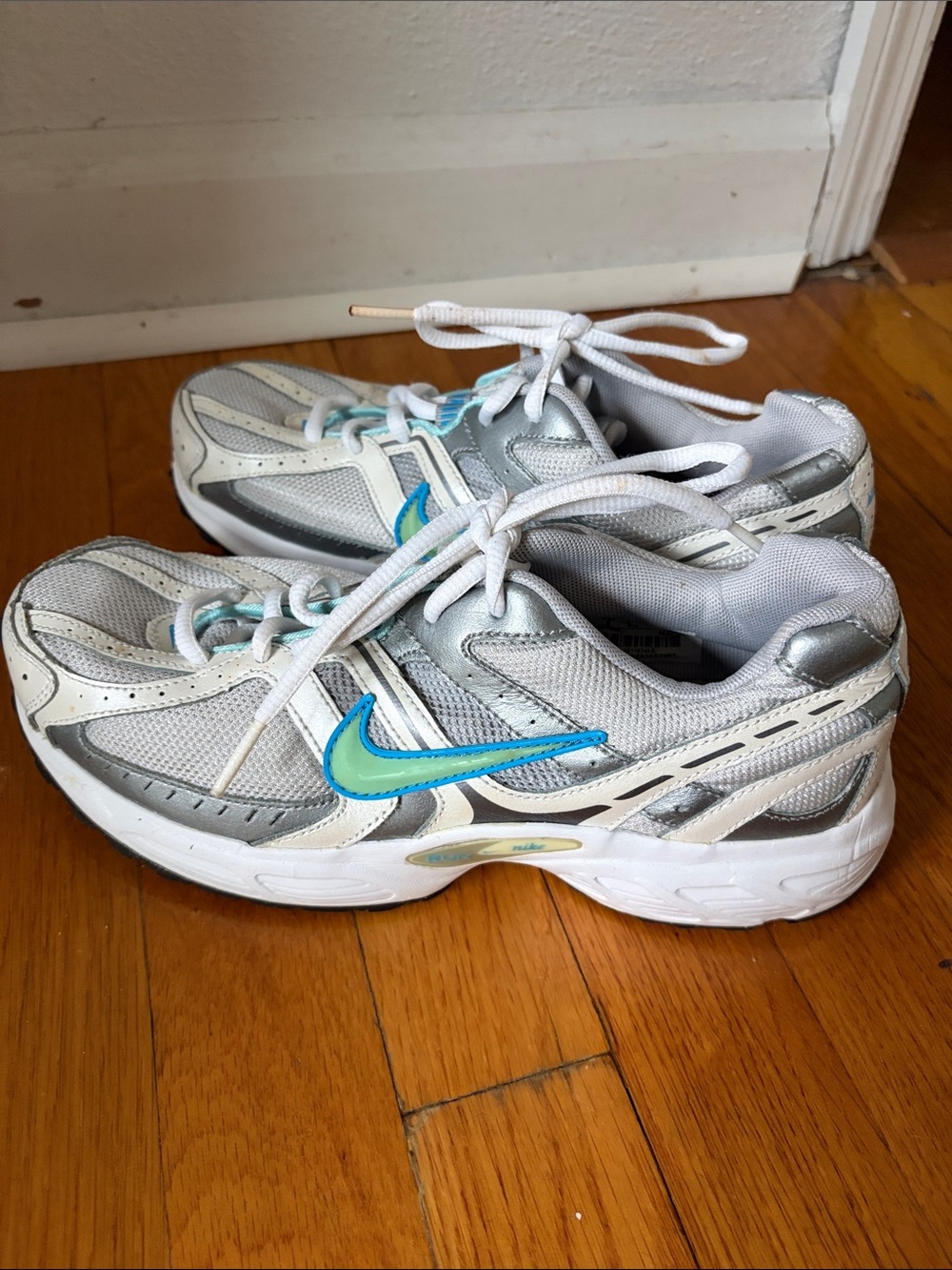 Nike Women's White and Gray Sneakers with Blue Swoosh